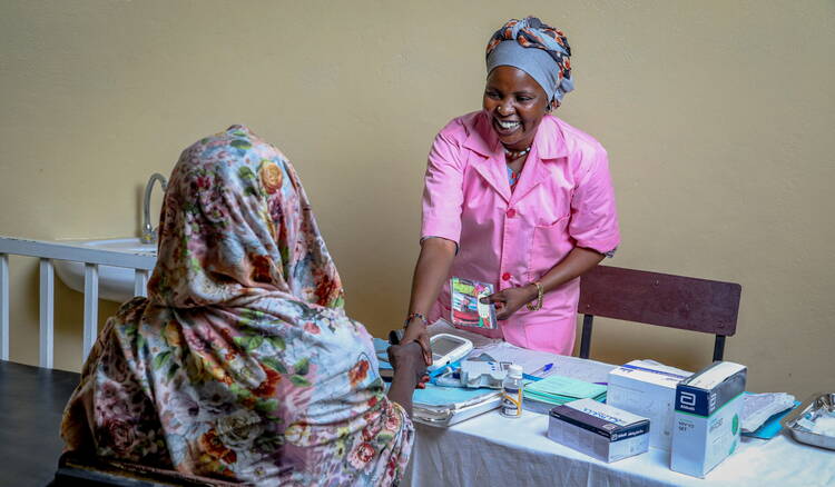 Midwife and Patient in Maternité, Chad