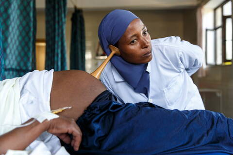 Midwife during examination, Ethiopia